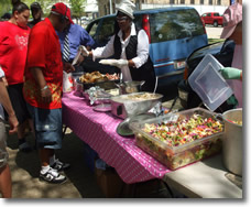 Sponsors of The Church in the Woods Services Serve Food to the Homeless